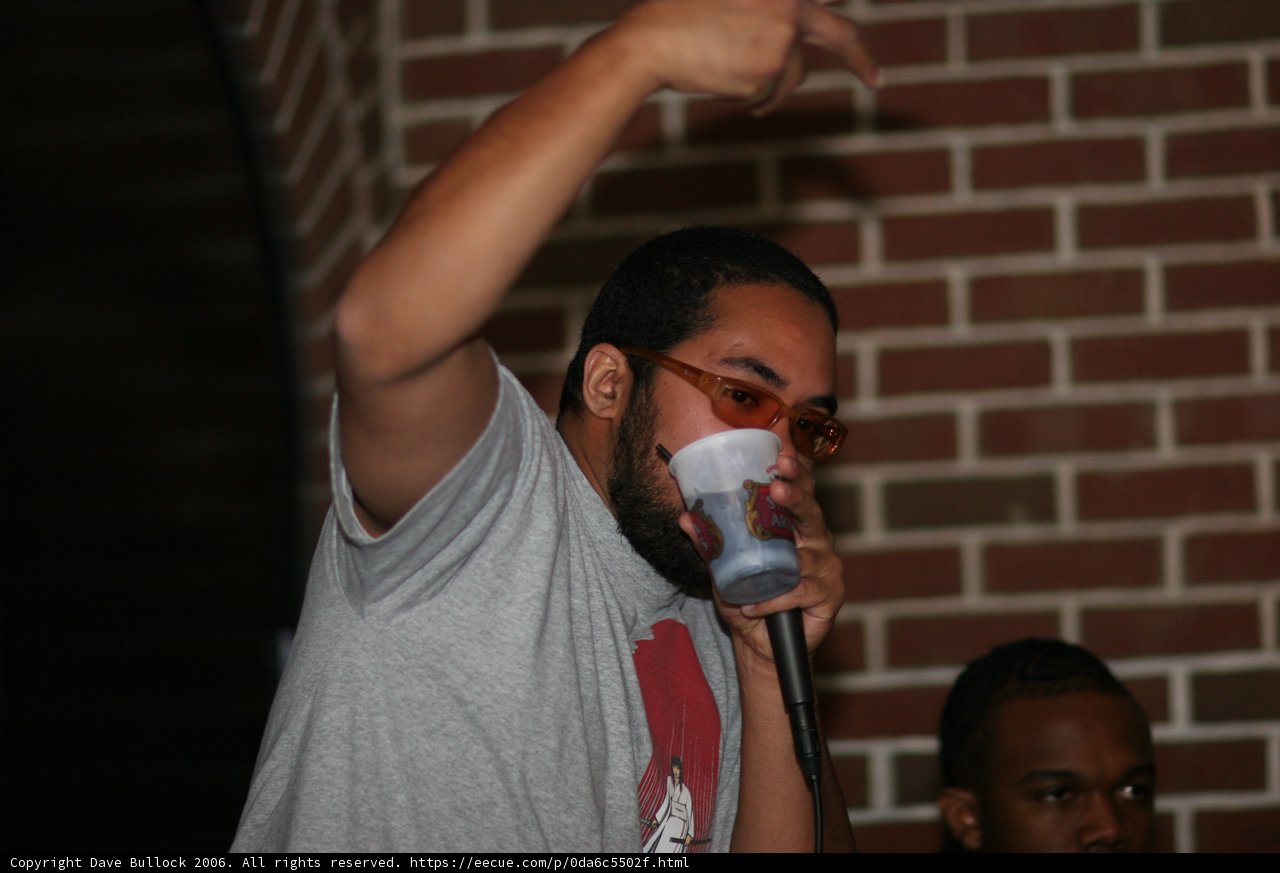 Man with Glasses enjoying a drink