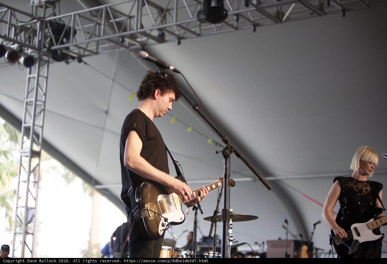 Sharin Foo performs on stage with guitar at Coachella 2010