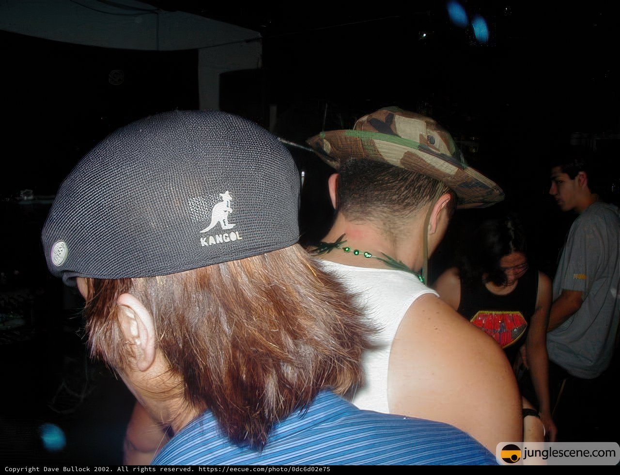 Hat-wearing man at a party