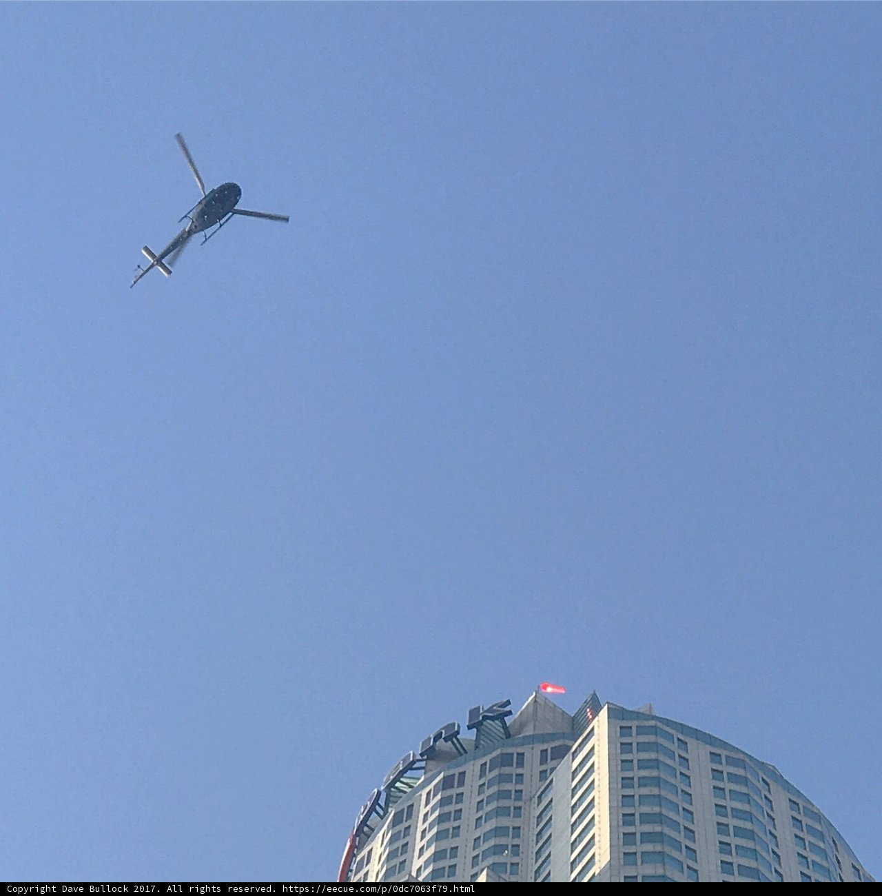 Helicopter Flying Over Los Angeles Skyscraper