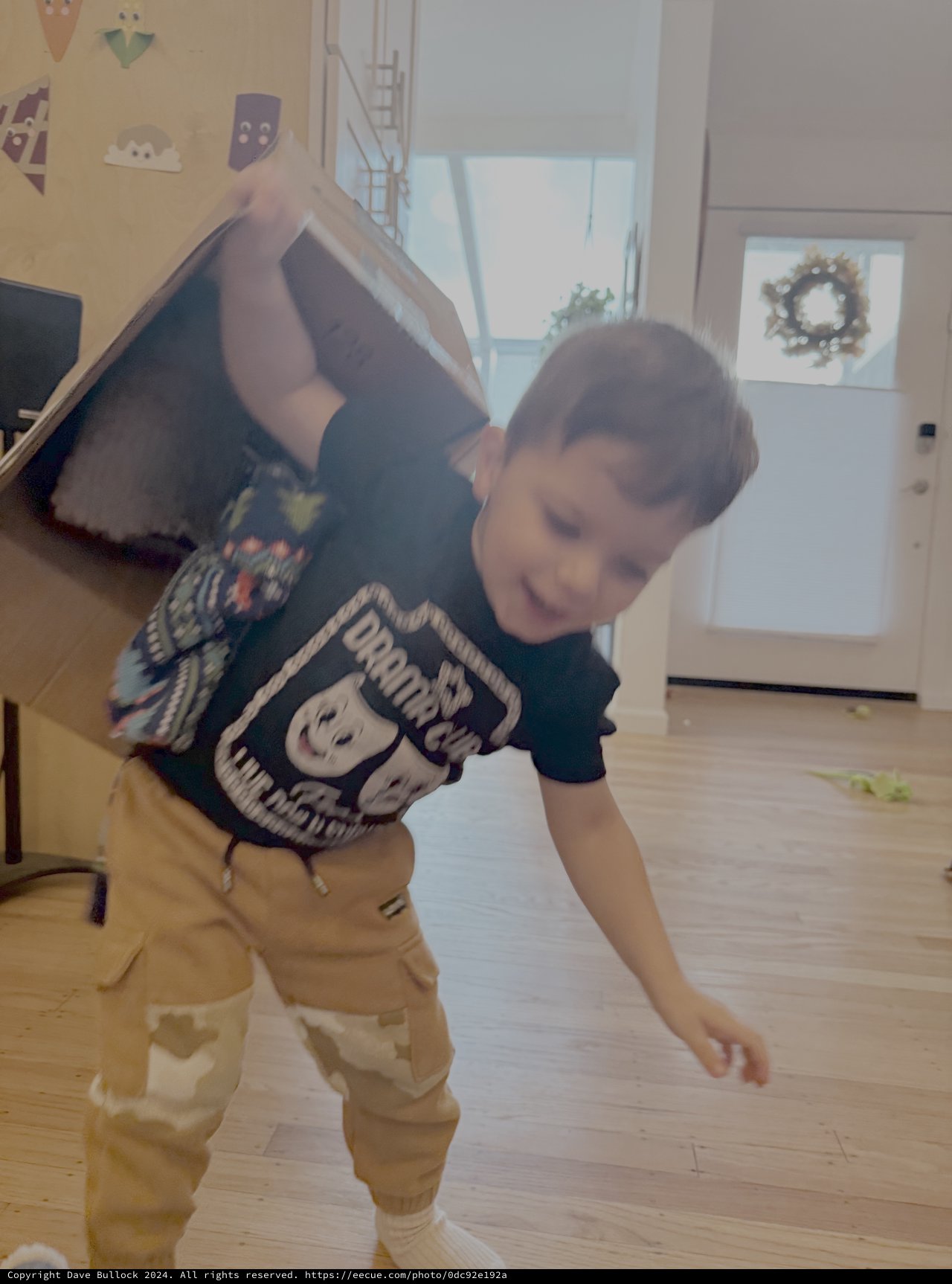 Child Playing and Stretching in Modern Home