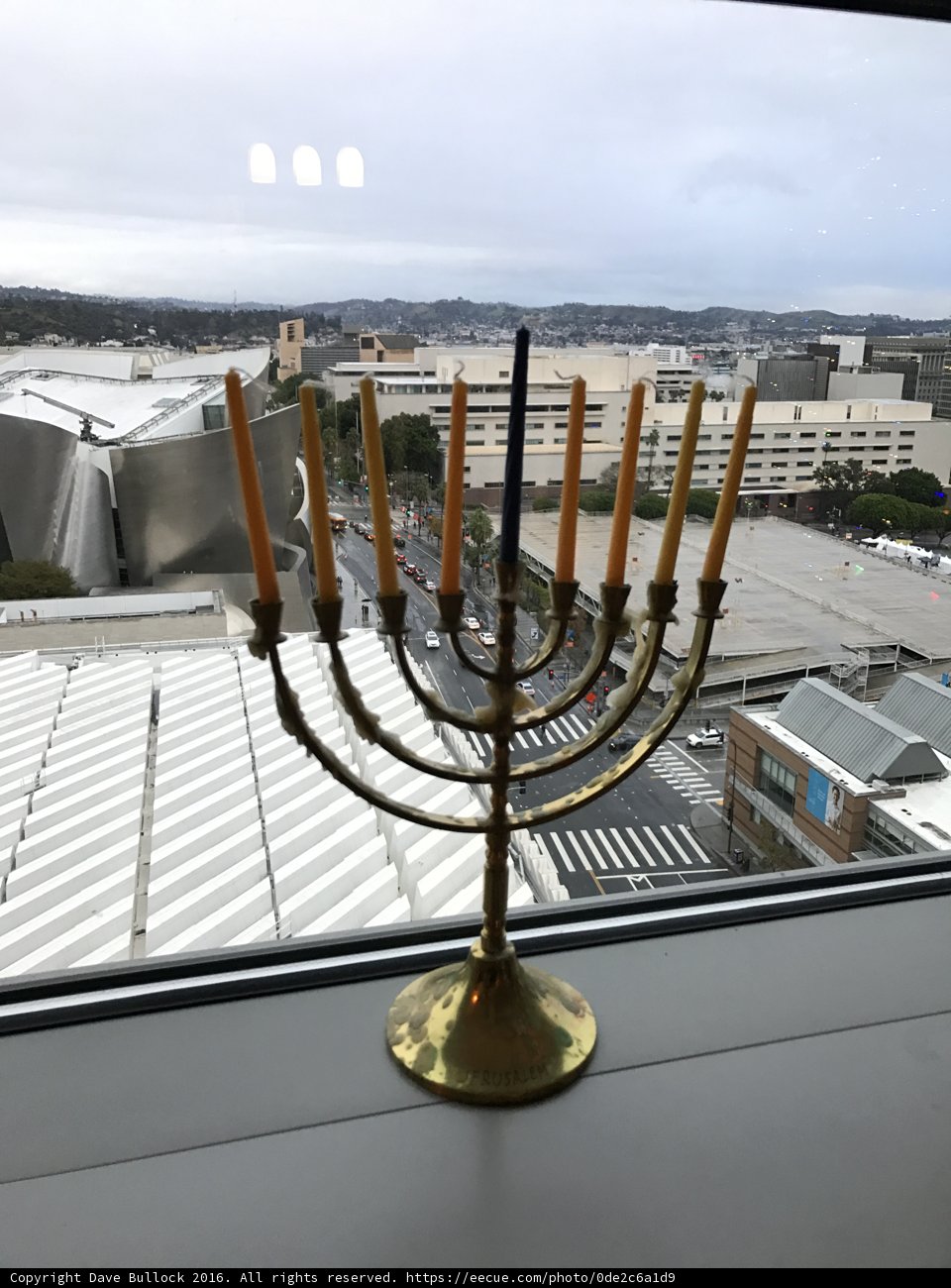 Hanukkah Menorah shining through the clouds