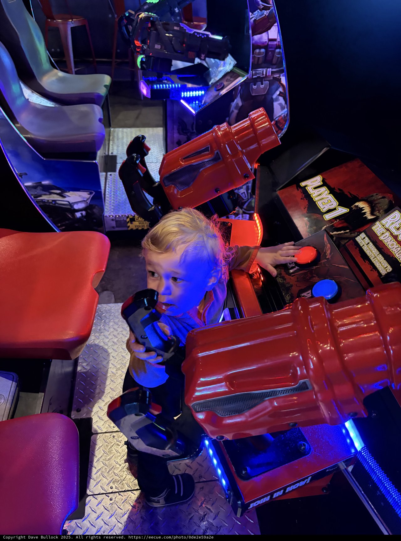 Young Child Exploring Interactive Arcade Racing Game