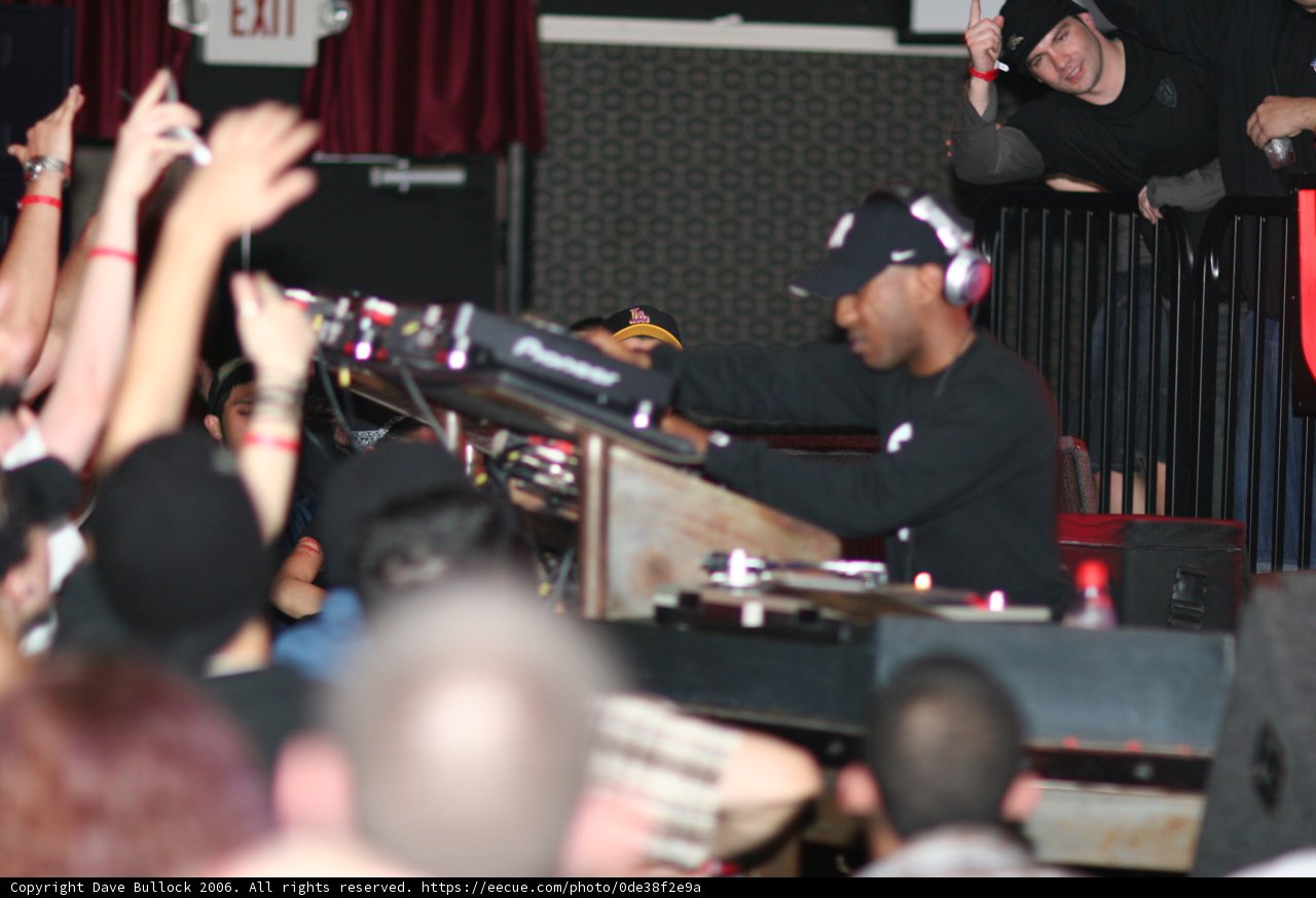 Entertainer Rocks the Crowd in Black Shirt and Baseball Cap