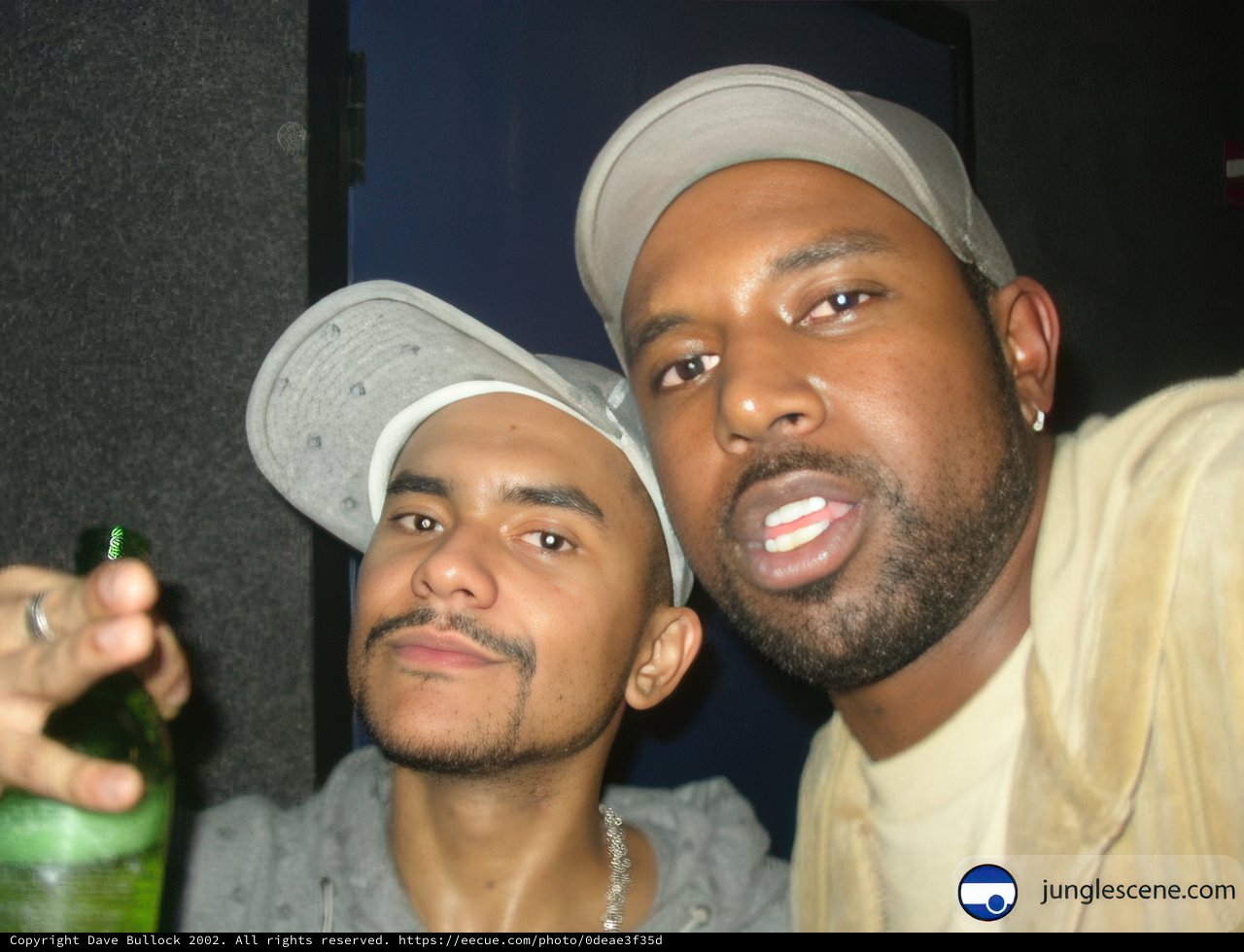 Two DJs Strike a Pose