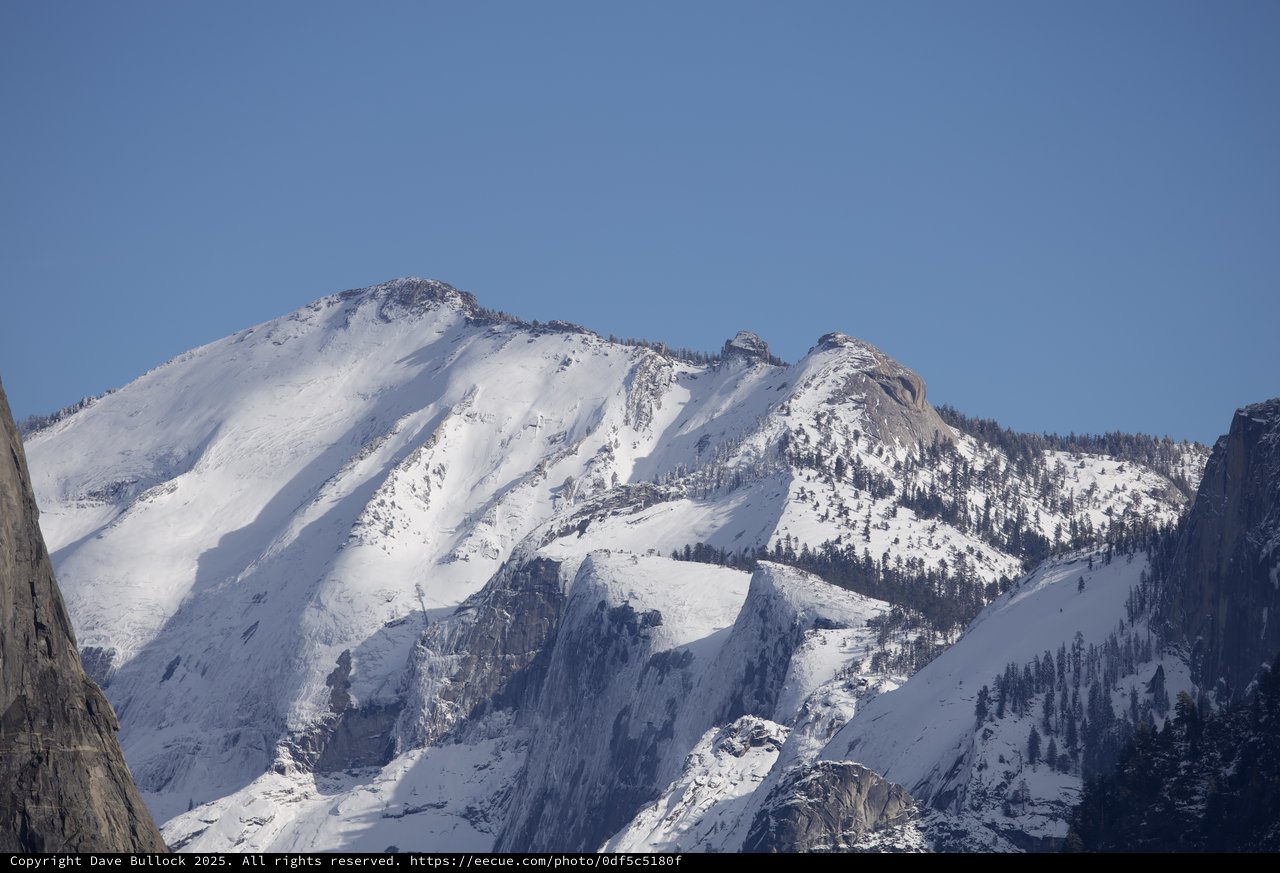 Snow-Covered Mountain Peaks in Winter Sunlight