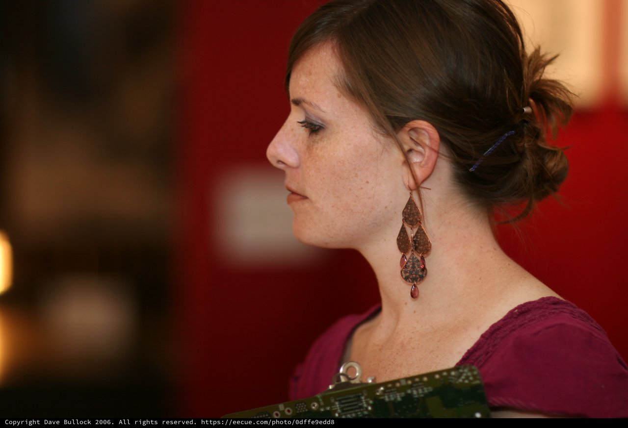 Contemplative Woman in Profile at Art Walk