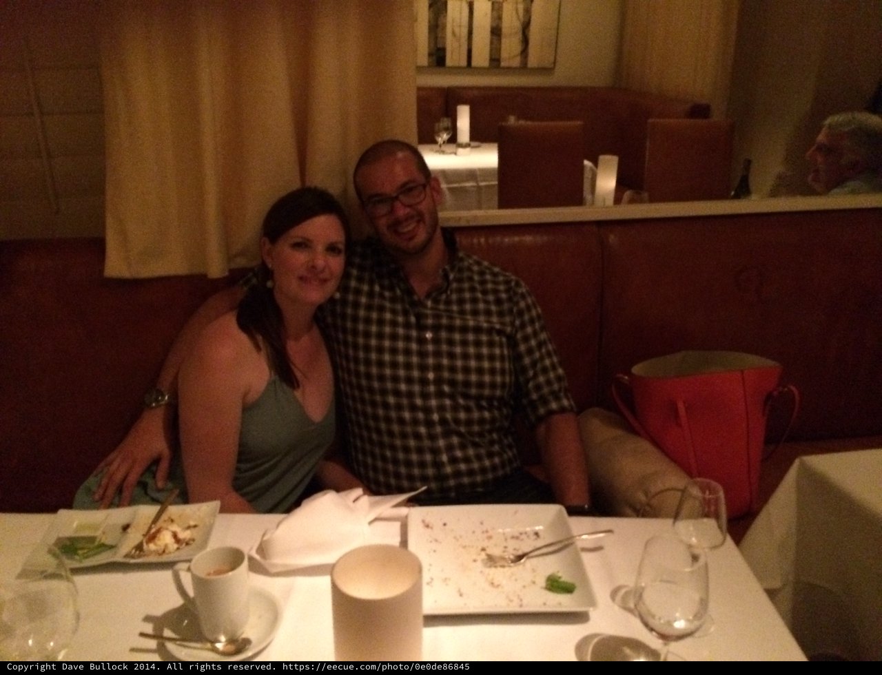 Couple Enjoying a Romantic Dinner at Restaurant