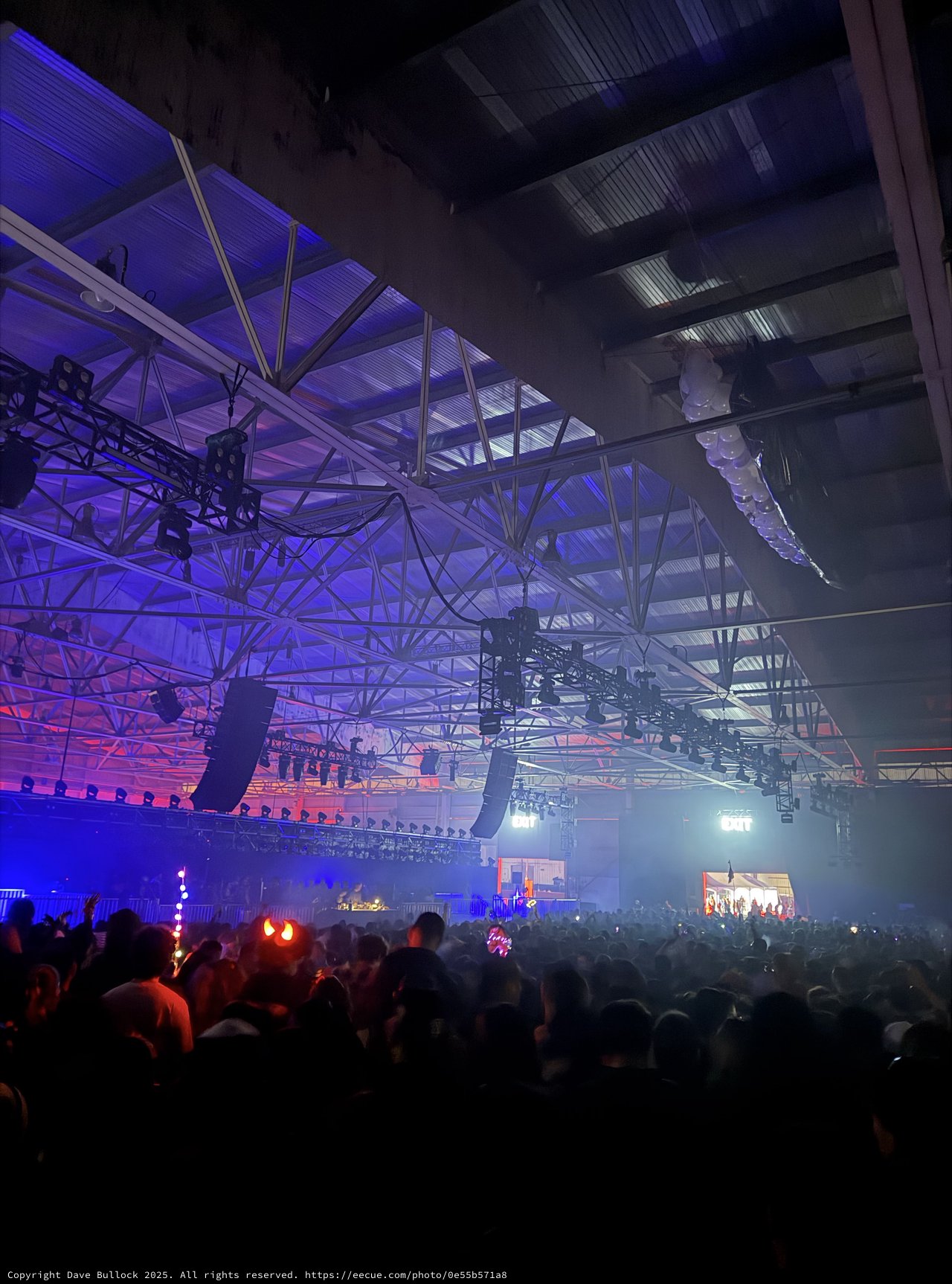 Electronic Music Festival with Dramatic Purple Stage Lighting