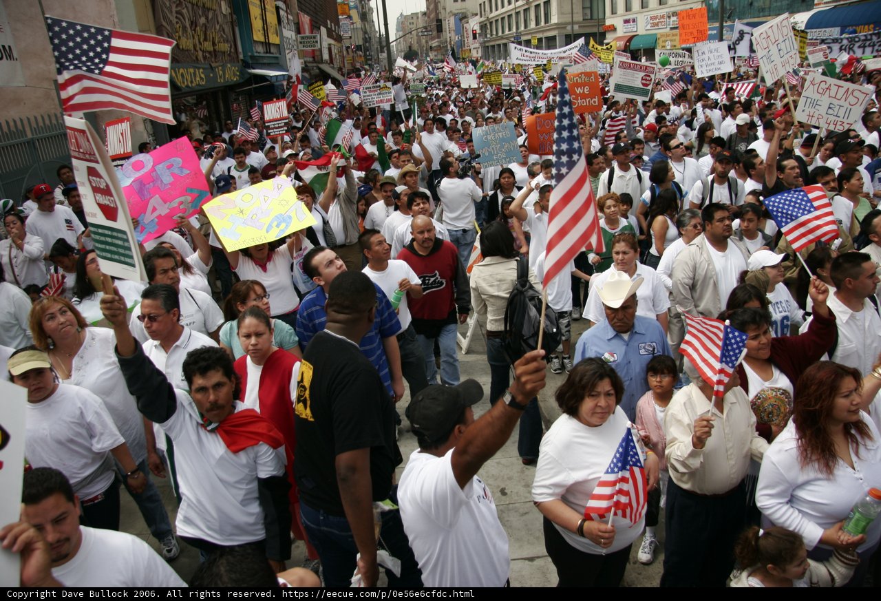 Proud Americans Marching With Flags and Signs