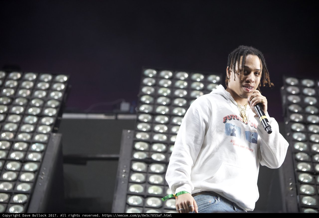 Hoodie-wearing Entertainer with Microphone