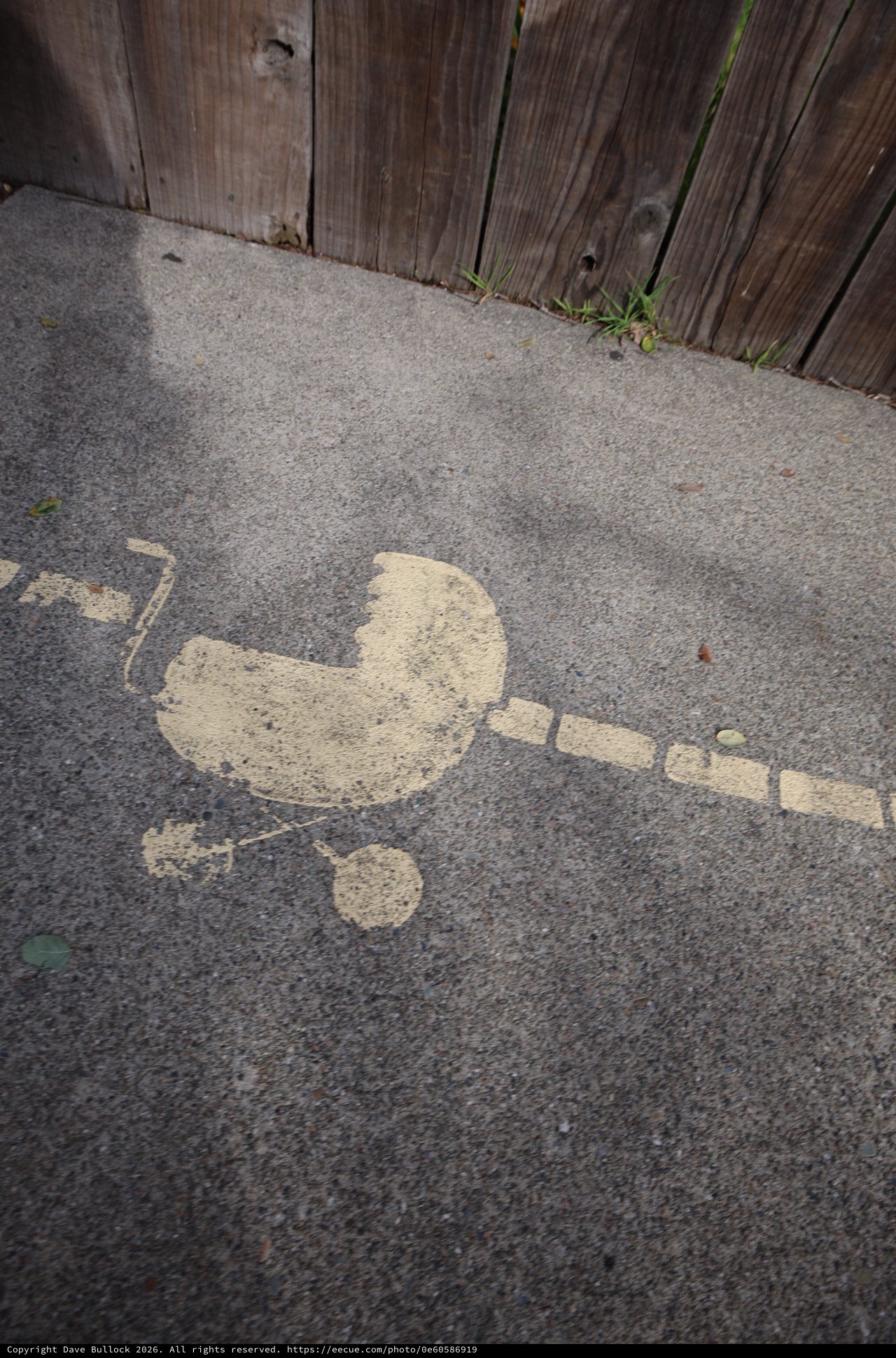 Spray Painted Stencil Art on Urban Sidewalk