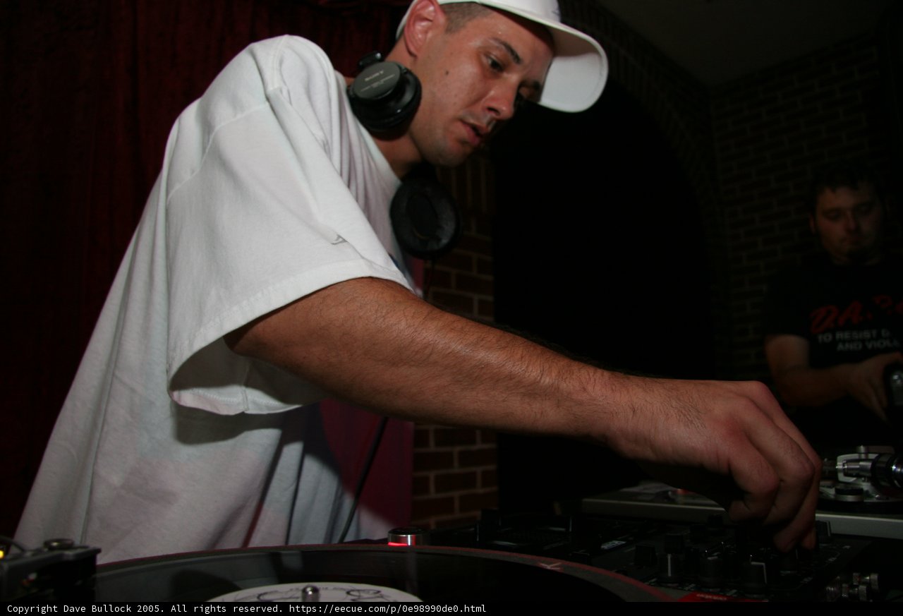 DJ S Spinning Tracks in White Tee