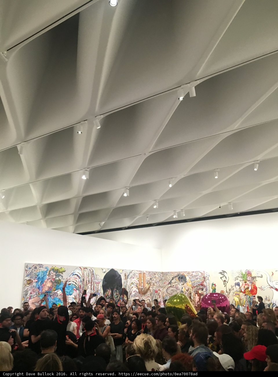 A Captivated Crowd in the Art Gallery