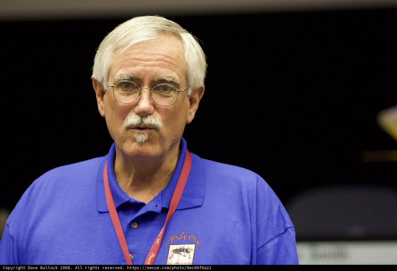 Older man with mustache and glasses at Phoenix post interview