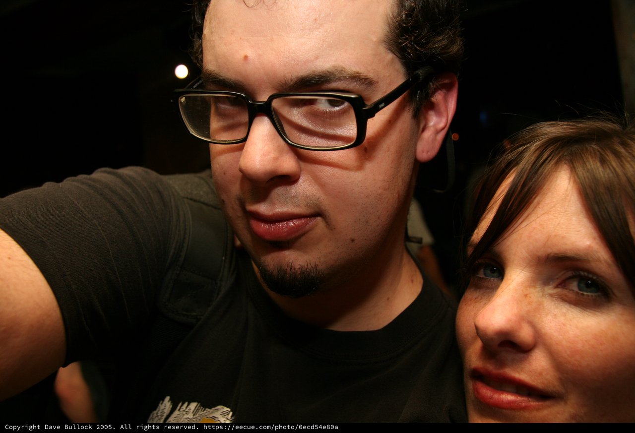 Two Friends Share a Close Moment at a Nightclub