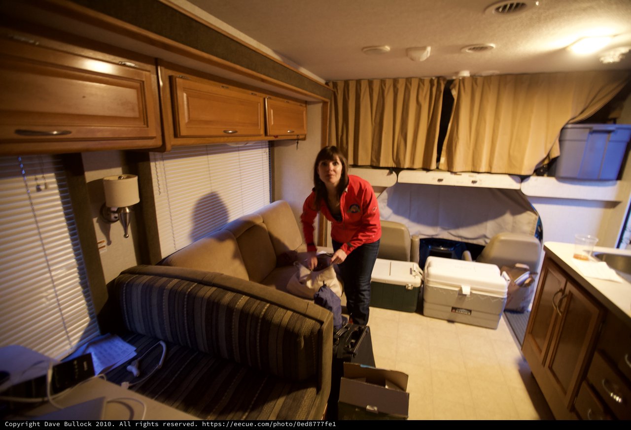Woman Organizing Gear Inside RV at Coachella Festival