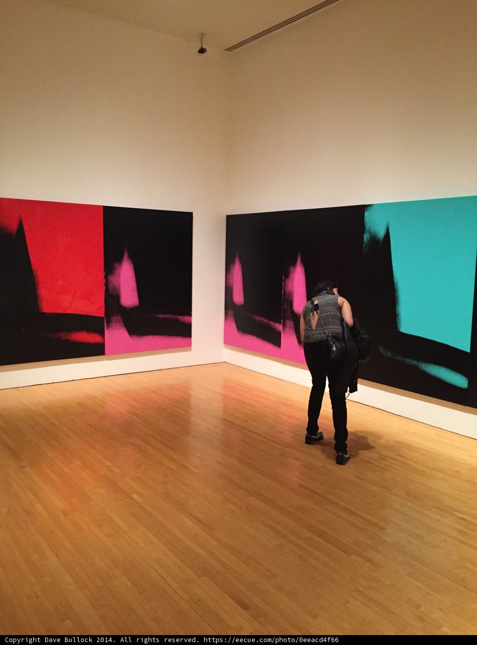 Man Contemplates Modern Art in Art Gallery