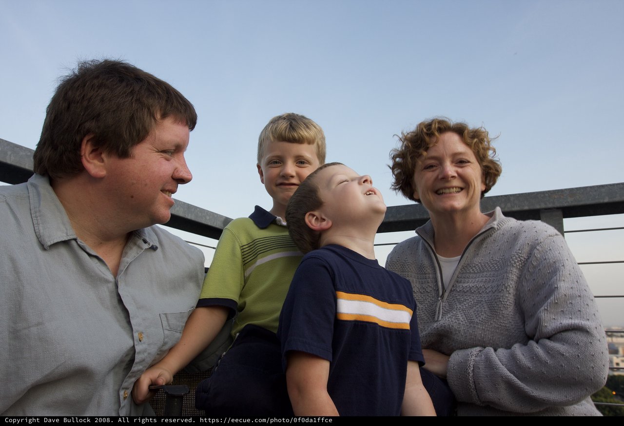 Family Moment on a City Rooftop at Dusk