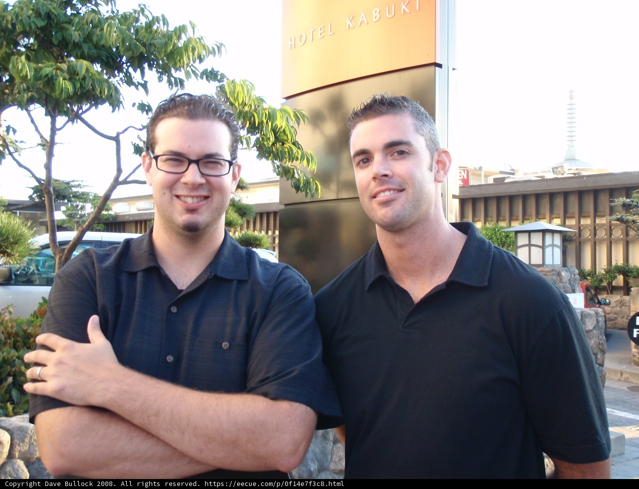 Two Friends in Front of City Building