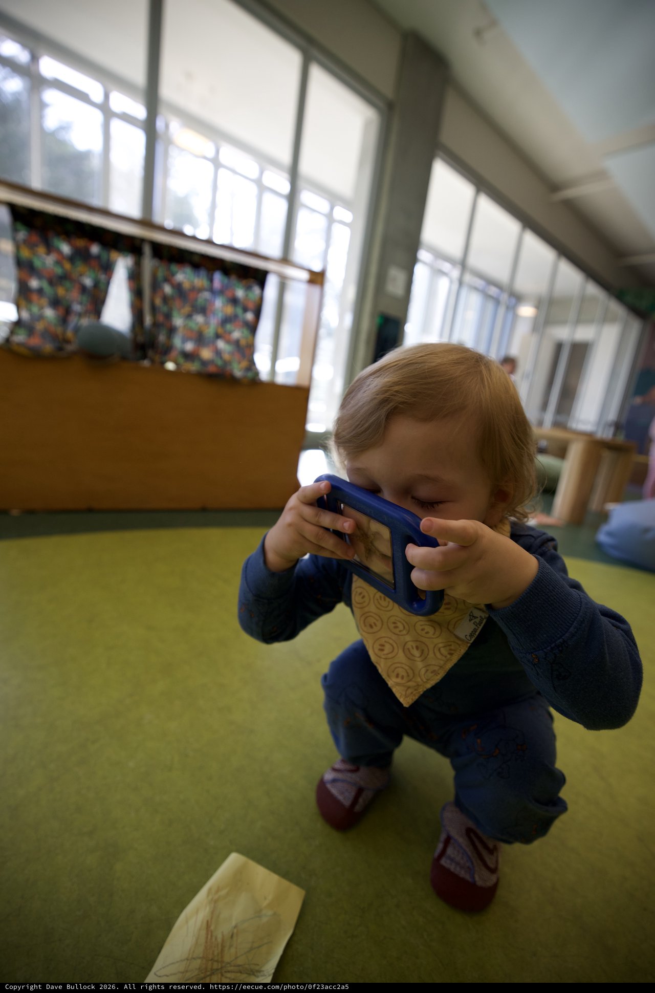 Young Child Taking Photo with Blue Tablet Device