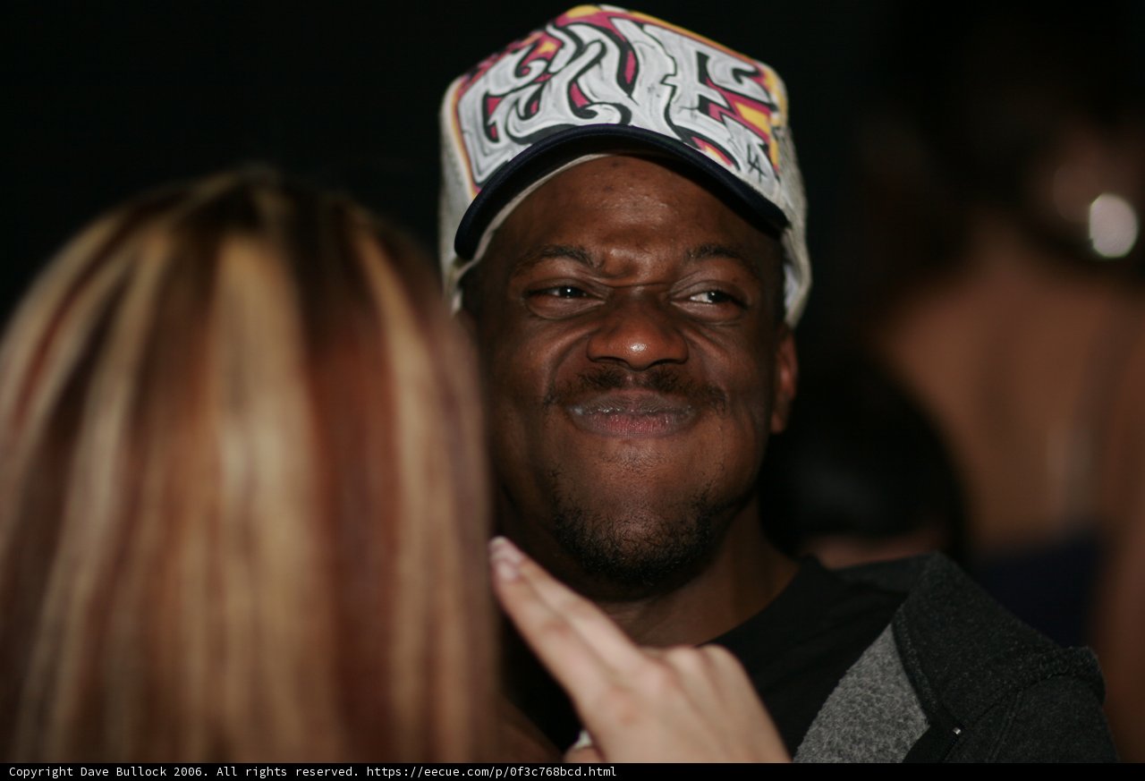 Smiling Man in Baseball Cap