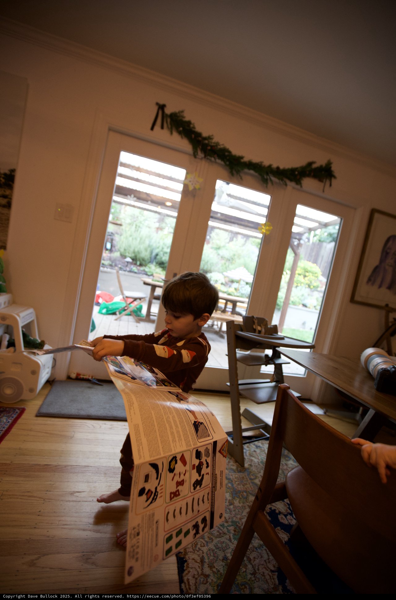 Child Building Cardboard Playhouse on Christmas Day