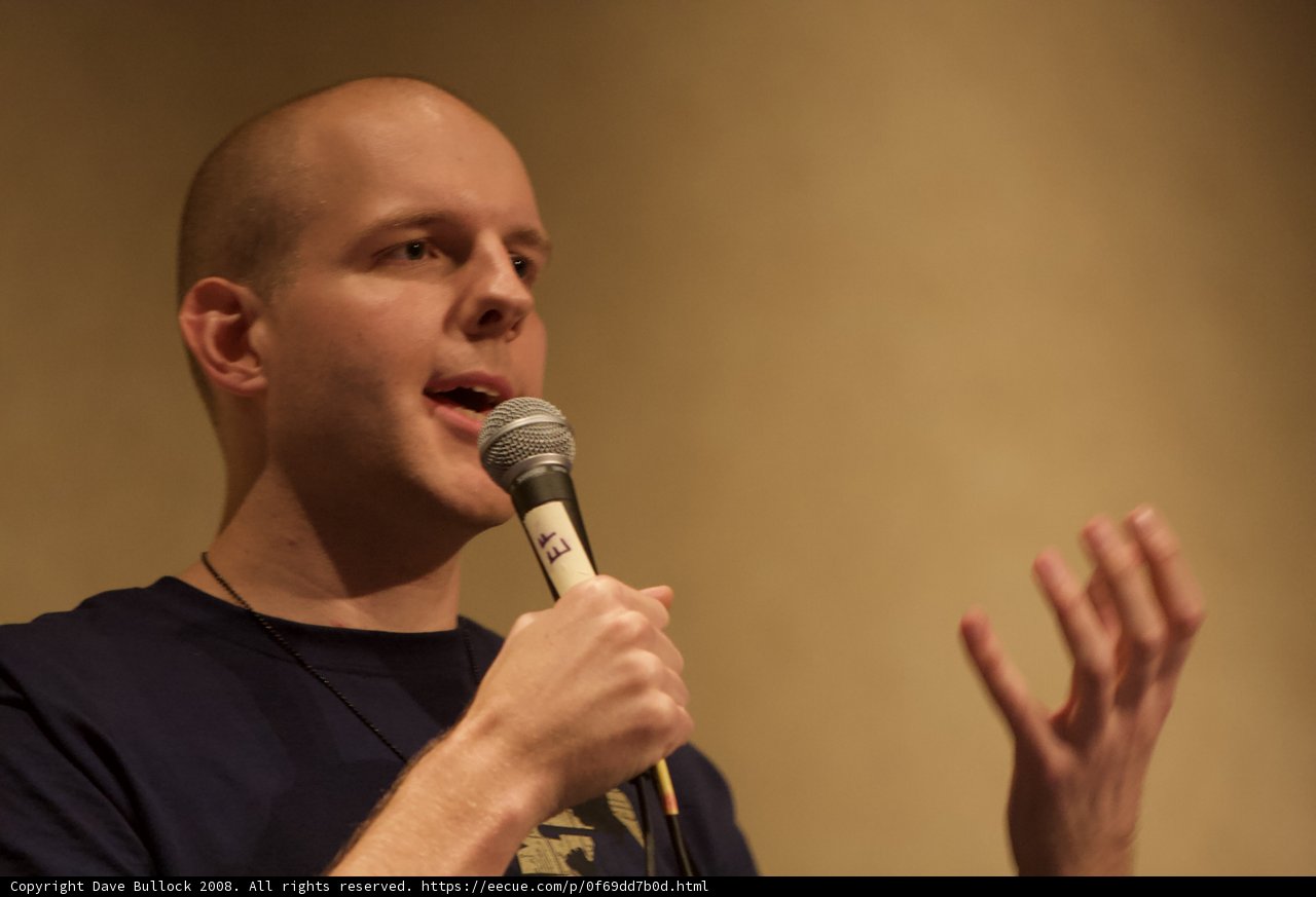 Bald Man sings his heart out with a Mic