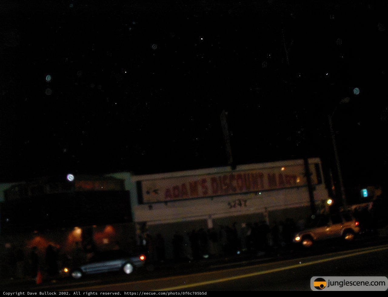 Nighttime Crowd Gathers in Urban Area