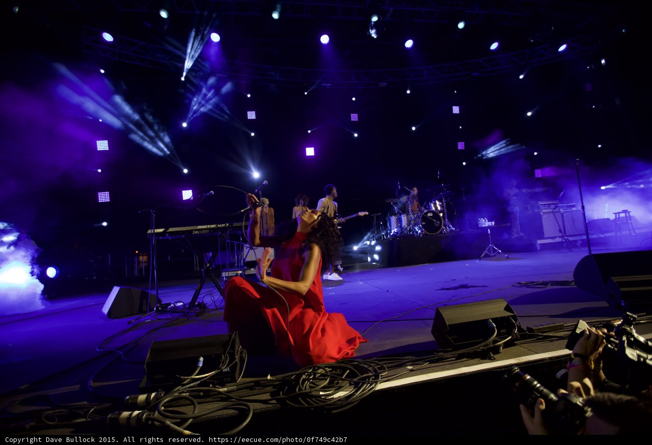 Solange Kneeling Looking Up Arm Extended Purple