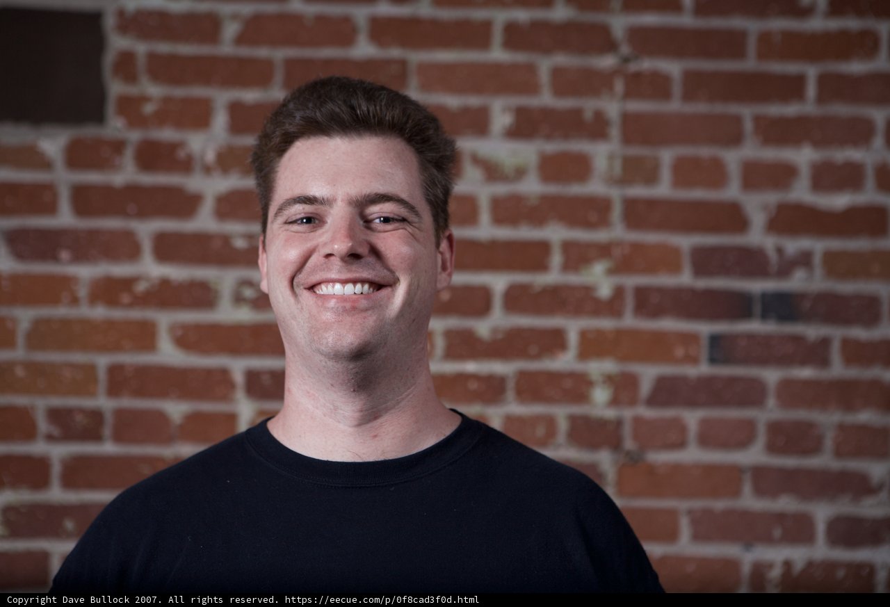 The Happy Man with the Brick Wall