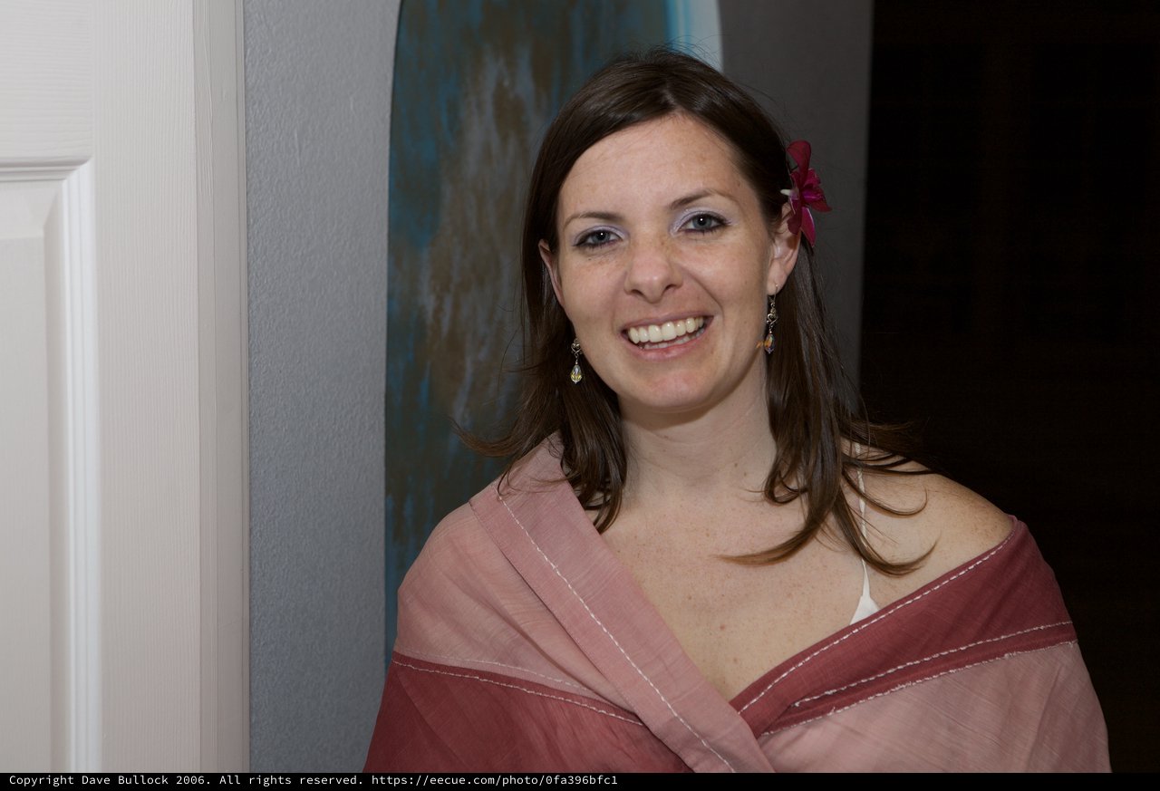 Radiant Woman in Pink Shawl at Wedding Celebration