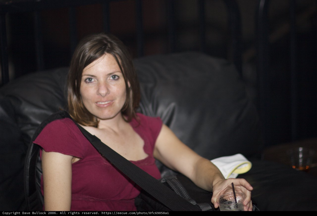Relaxed Woman at Nightclub with Cocktail