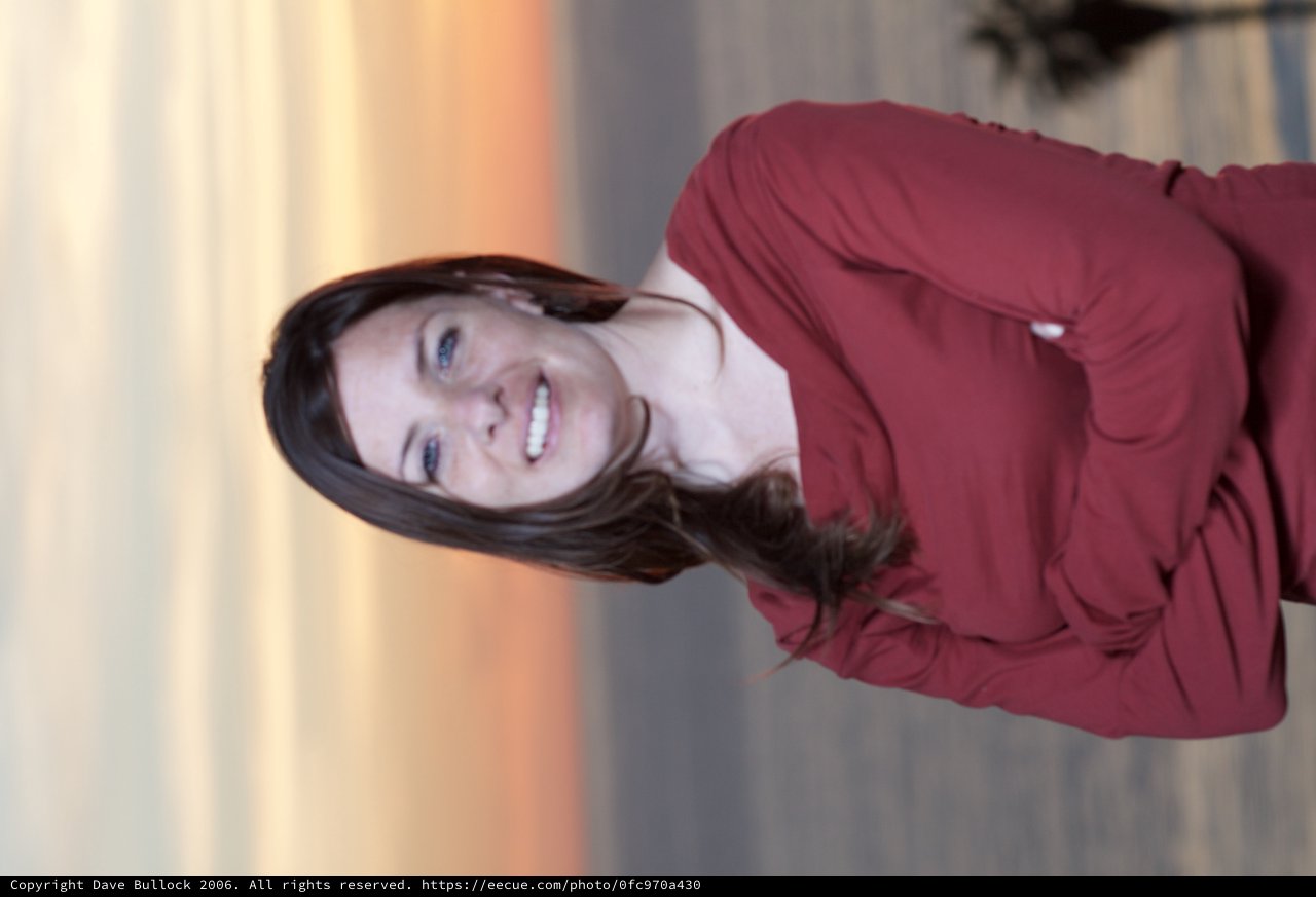 Woman in Red at Golden Hour Seaside Portrait