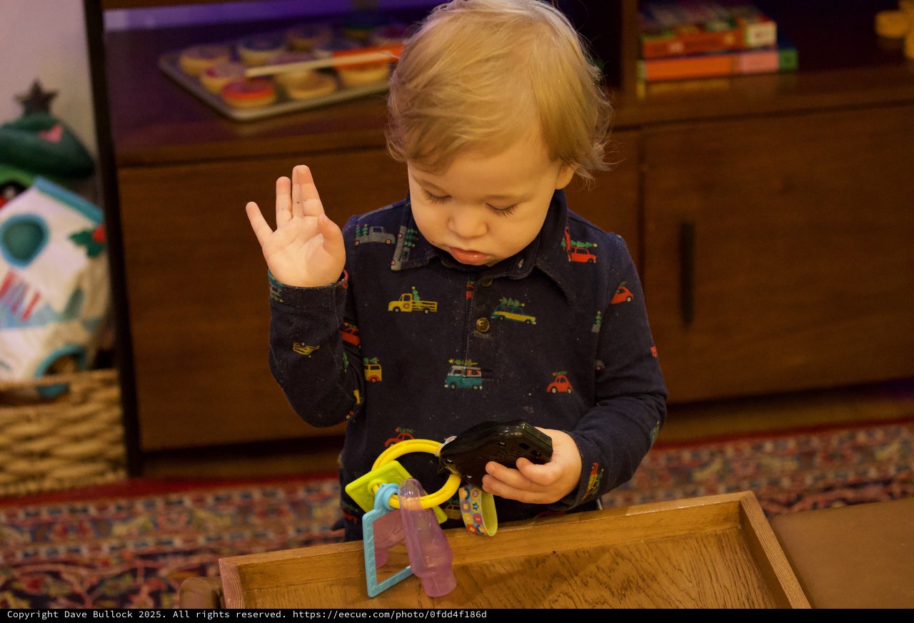Toddler Concentrated on Toy During Christmas Morning Play