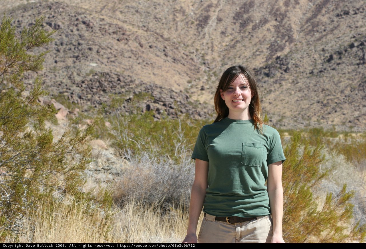 Young Woman Smiling in Arid Desert Landscape