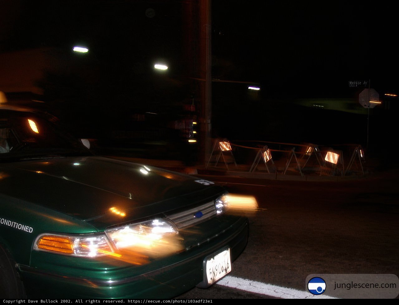 Green Coupe Racing Through the Night