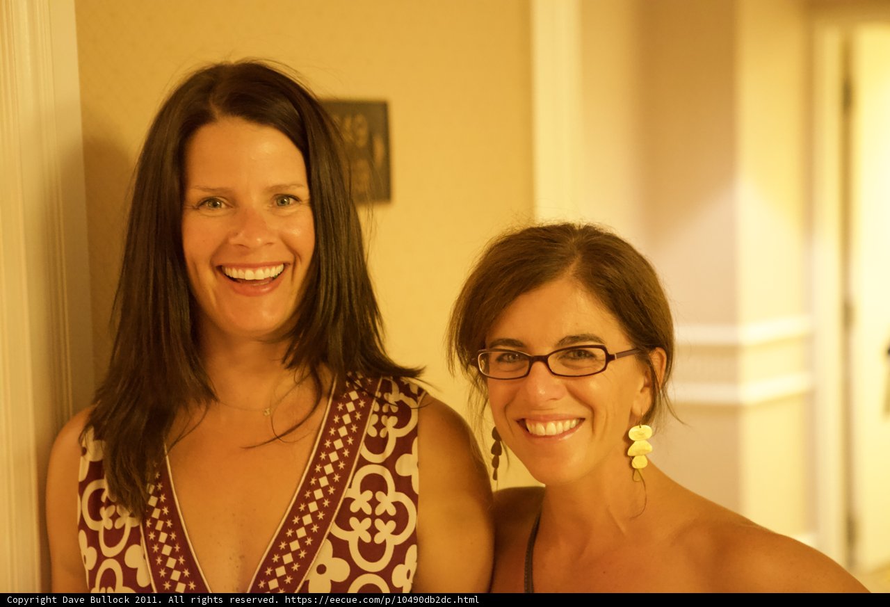 Two Women Beaming on a Joyful Occasion