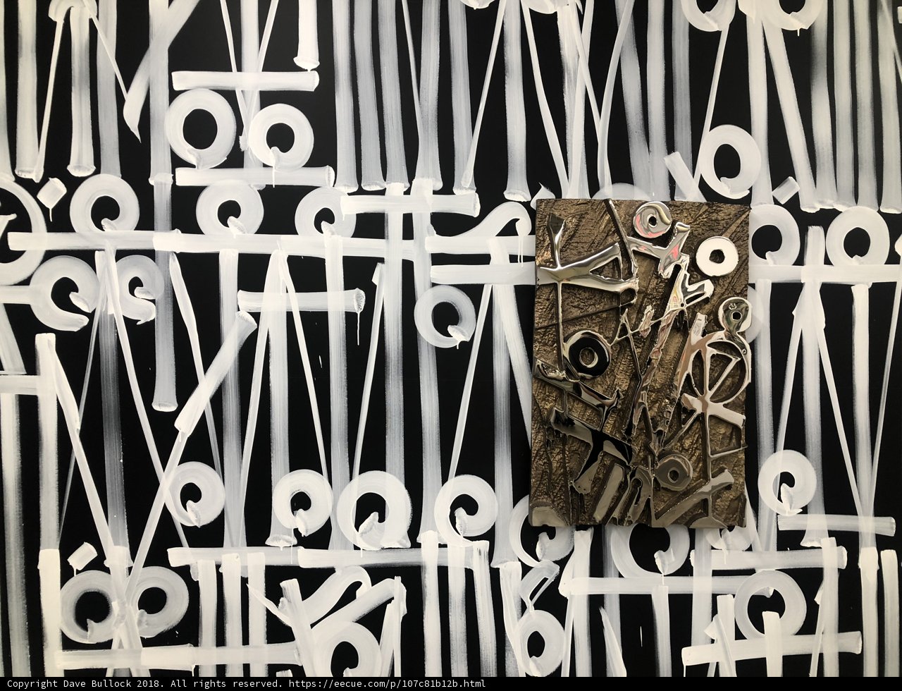 Collage of Symbols and Text on Wooden Frame