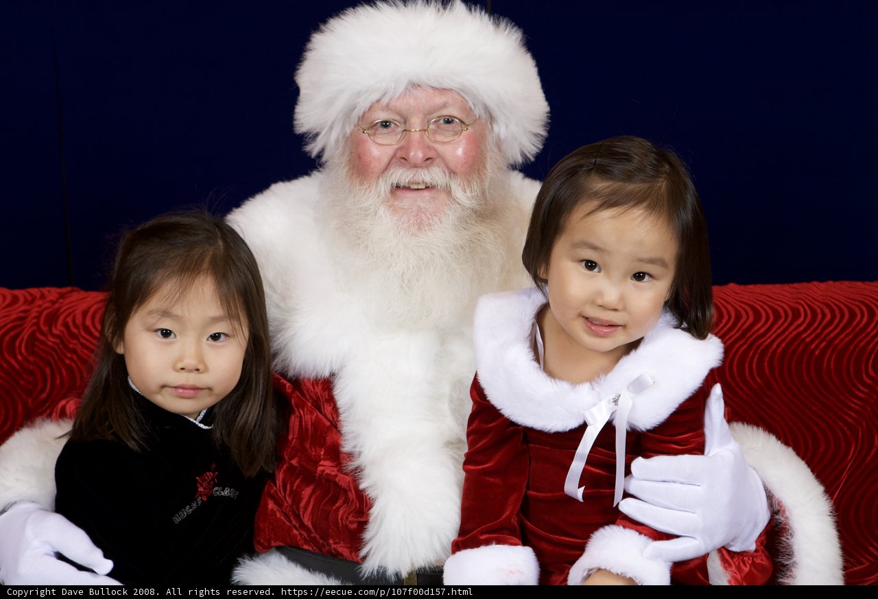 Santa Claus Spreads Christmas Joy with Two Little Girls