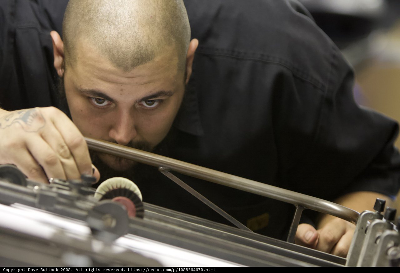 Man Operating a Manufacturing Machine