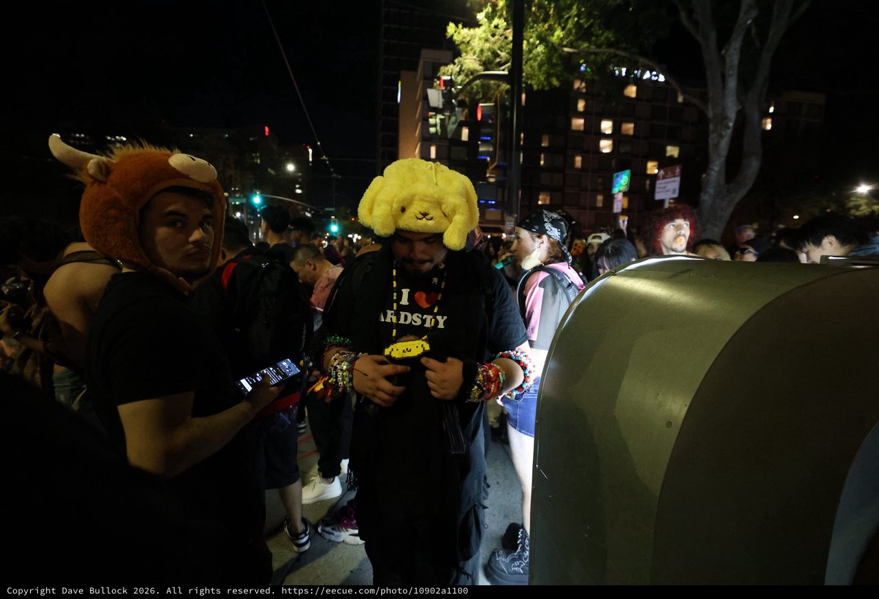 Costumed Ravers Navigate Night Festival Crowd Together