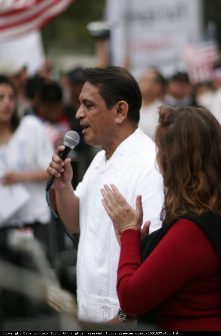Protest Leader Addresses Crowd with Microphone