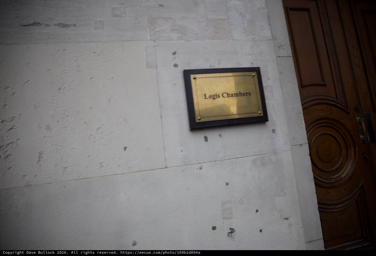 Legis Chambers Brass Plaque on Weathered White Wall