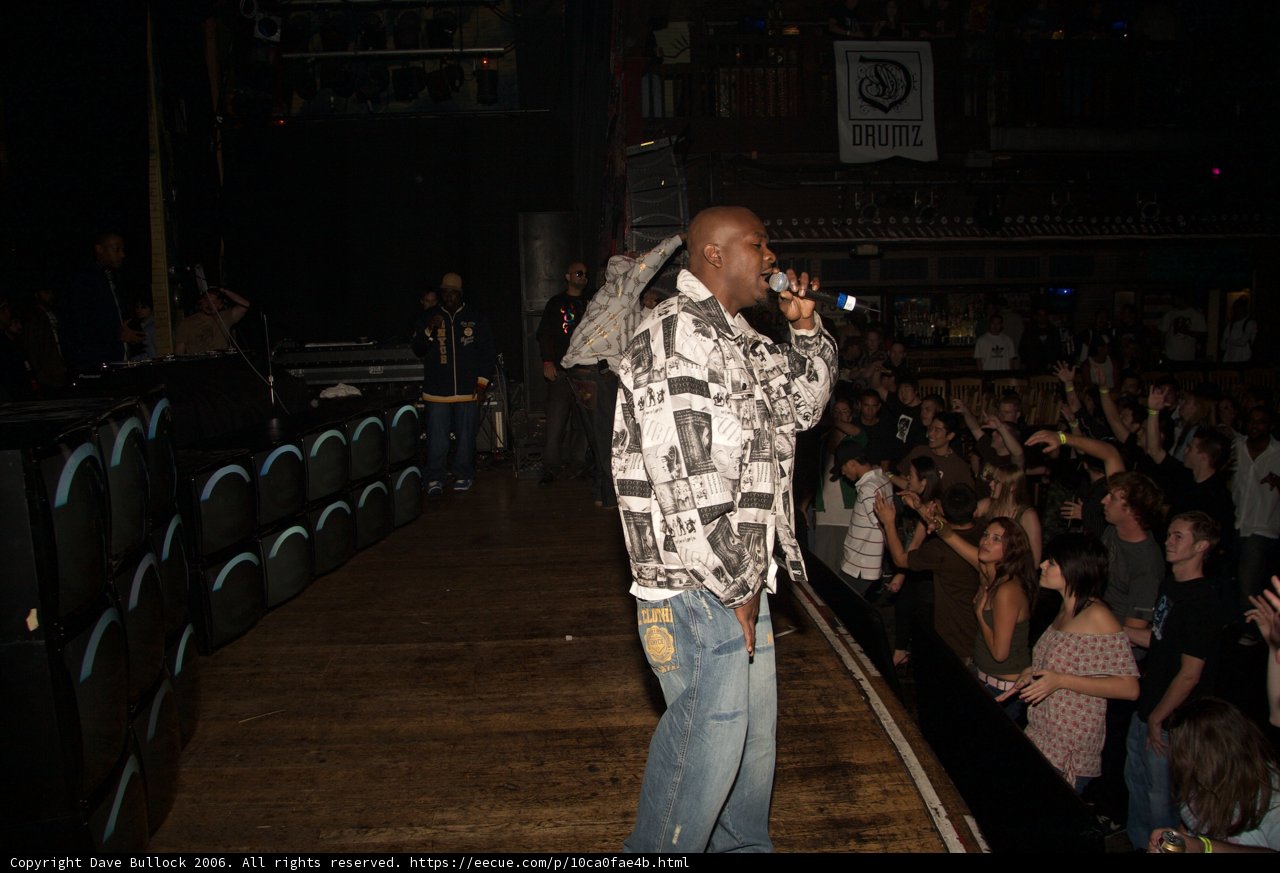 Man on Stage in Urban Auditorium