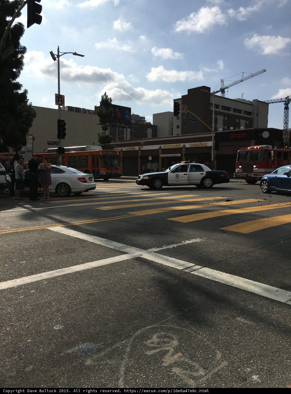 Busy street with police car