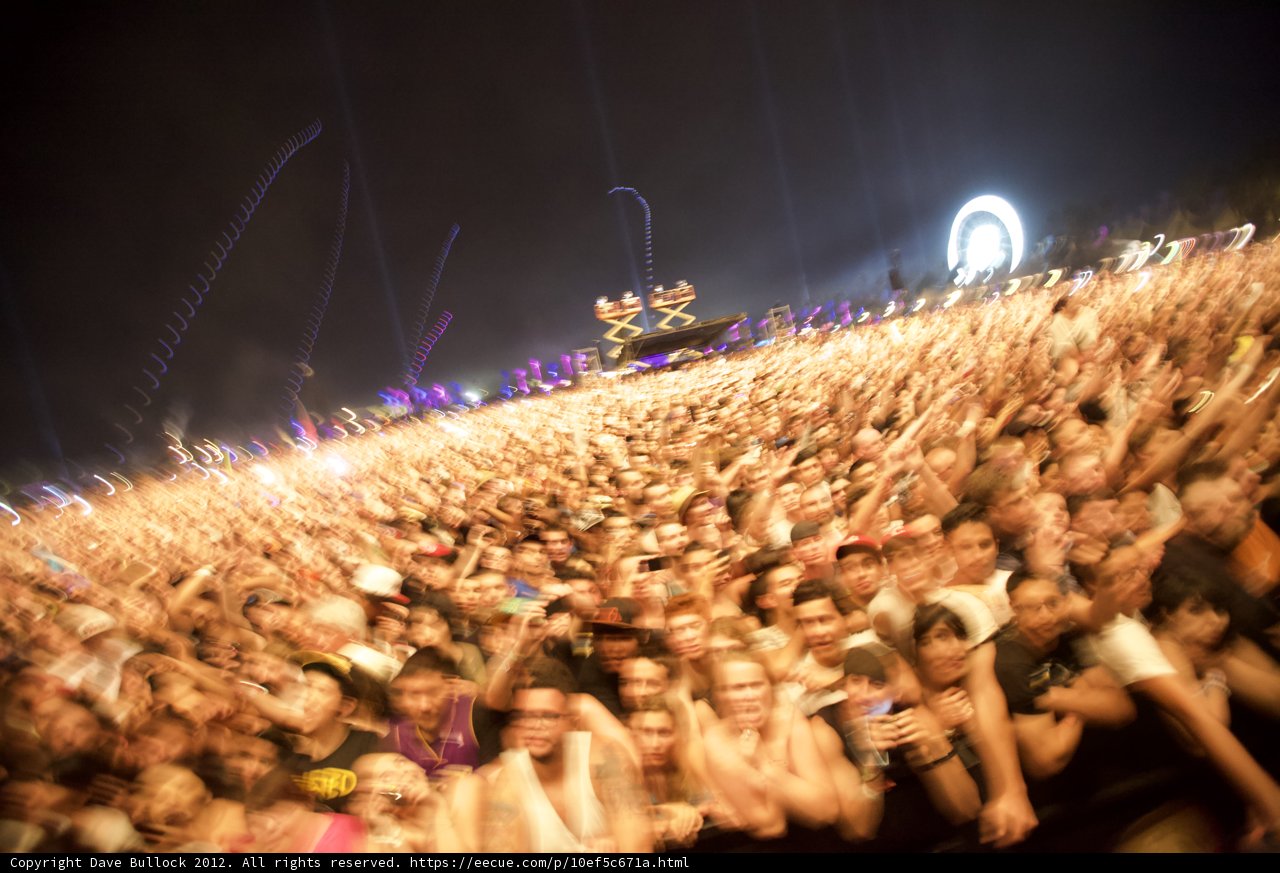 Coachella Music Fest Unites the Crowds Caption: The night sky ignites in celebration as thousands gather at Coachella Music Festival, enjoying the electrifying pyrotechnics and captivating performances. With faces glowing and heads bobbing, the crowd comes alive in a sea of energy and excitement.
