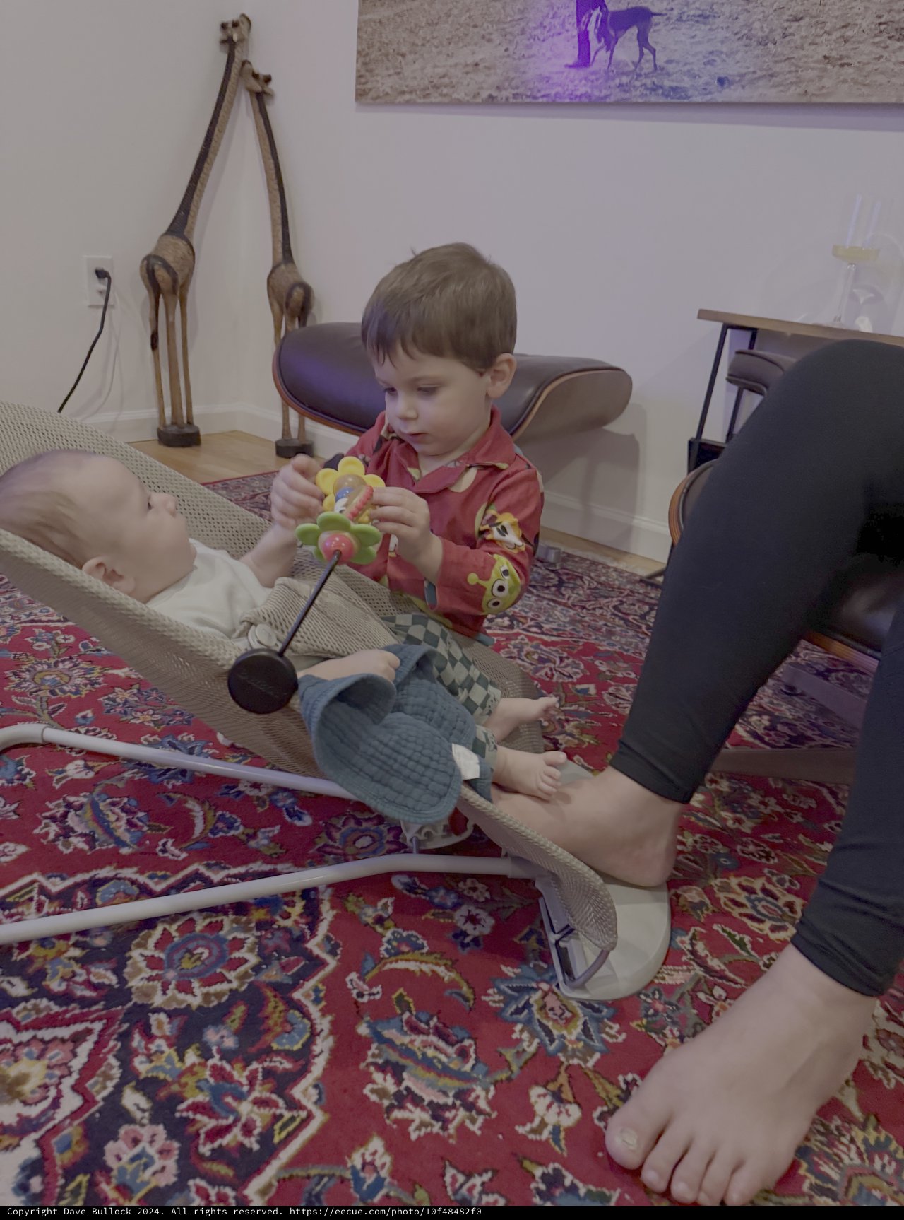 Toddler Playing with Baby During Indoor Playtime