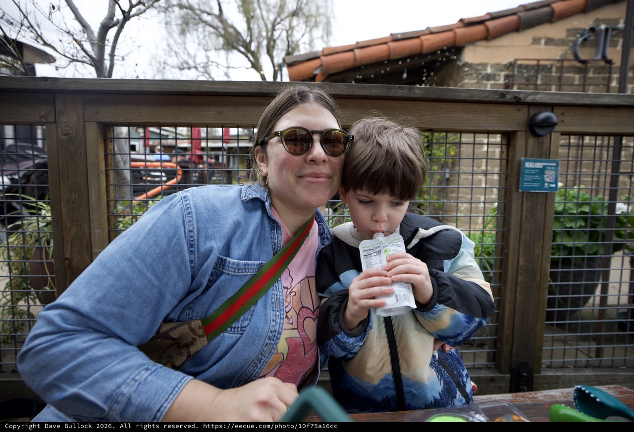 Mother and Son Enjoying Outdoor Refreshment Together