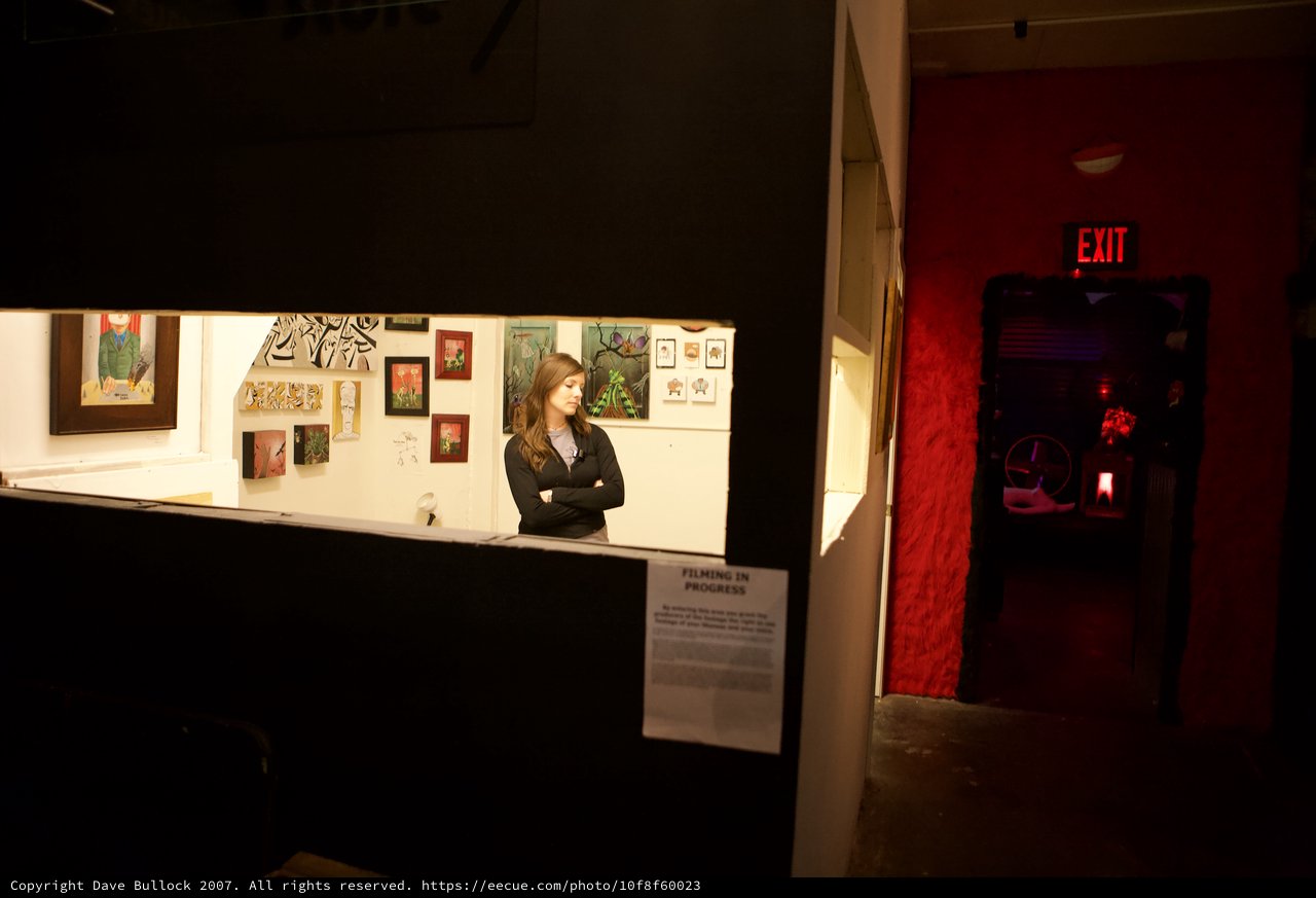 Gallery Attendant Watches Over Art Walk Exhibition